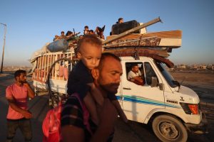 ‘We reside with the lifeless’: Gazans shelter in cemetery