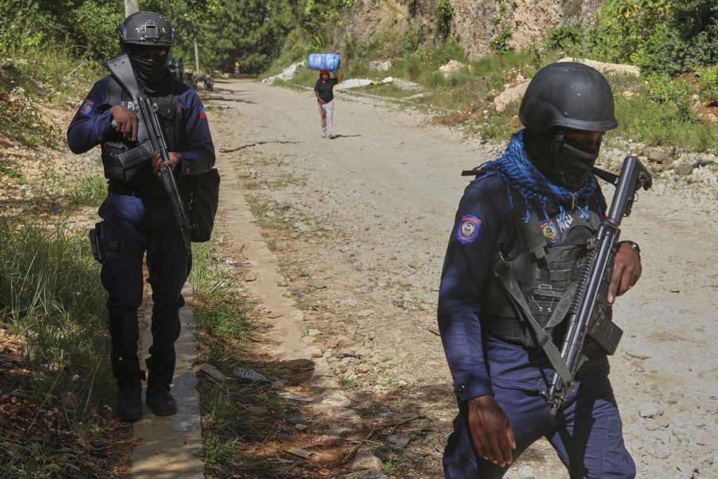 Gang assault on armored car in Haiti leaves 2 law enforcement officials injured and 1 driver lifeless