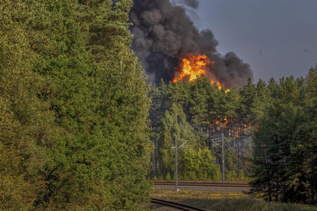 Explosions heard in Lithuania's capital after railcars loaded with liquefied gasoline catch fireplace