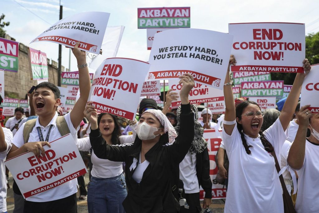 Philippine police arrest 17 for hurling rocks as hundreds peacefully protest corruption