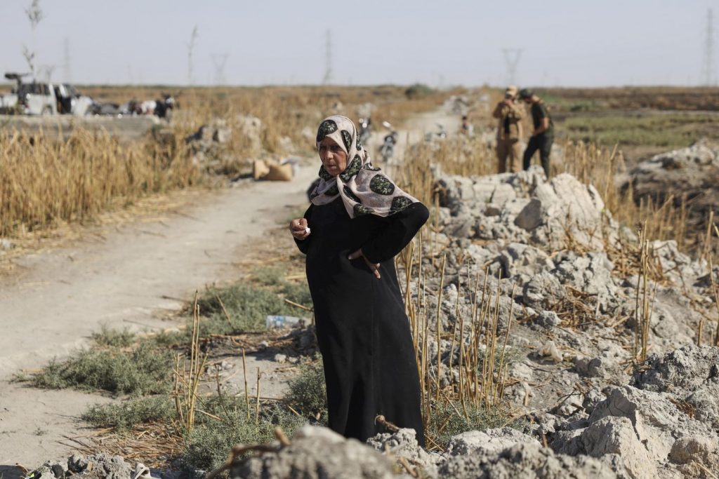 At a mass grave on the outskirts of Damascus, some households study the destiny of lacking family members