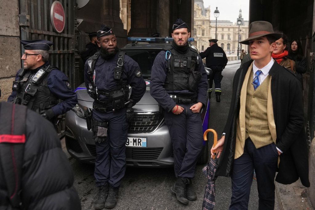 Inspector Clouseau? The thriller man in an AP photograph after the Louvre jewel heist creates a buzz Inspector Clouseau? The thriller man in an AP photograph after the Louvre jewel heist creates a buzz