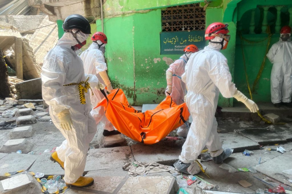 Loss of life toll from Indonesian faculty collapse rises to 14 as crews pull extra our bodies from rubble