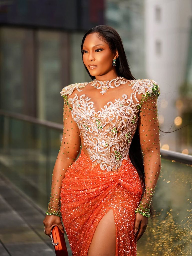Osas Ighodaro Stuns in a Fiery Orange Veekee James Robe That Screams Luxurious