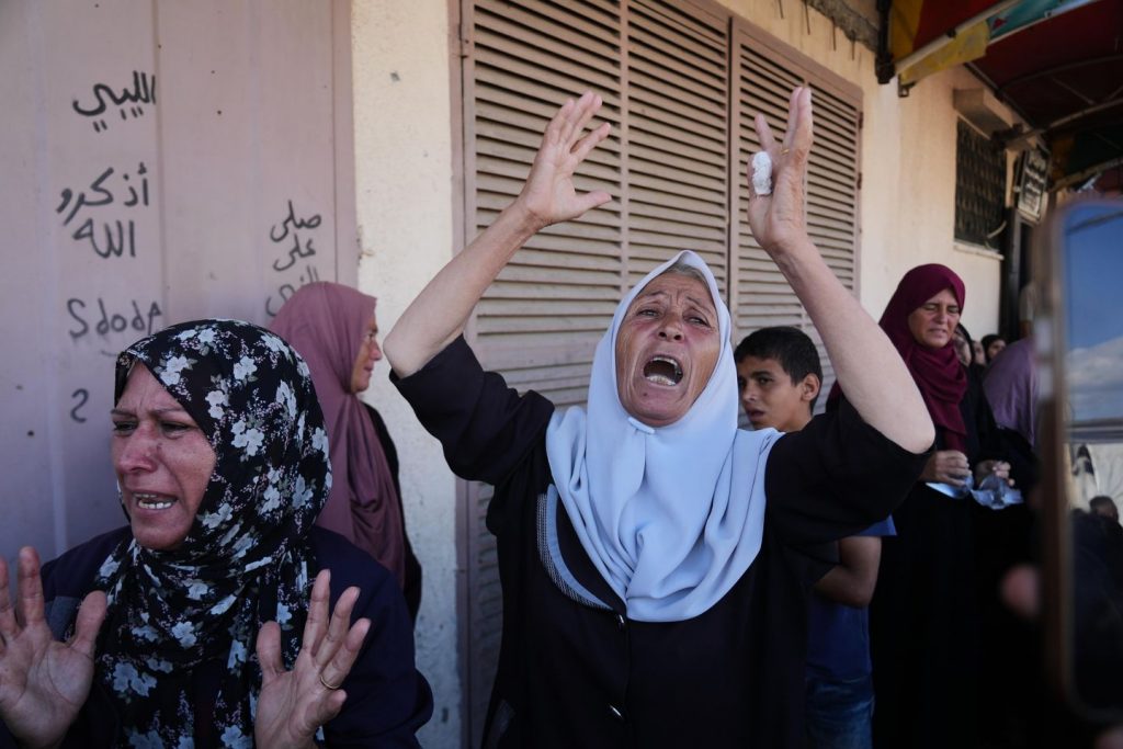 Israeli strikes in Gaza kill at the least 16 Palestinians as Hamas mulls its response to Trump's plan