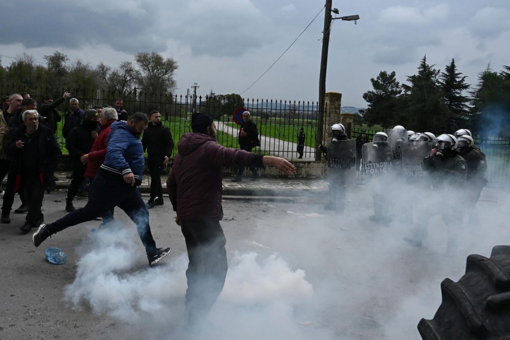 Greek police fireplace tear gasoline at protesting farmers threatening to blockade airport Greek police fireplace tear gasoline at protesting farmers threatening to blockade airport
